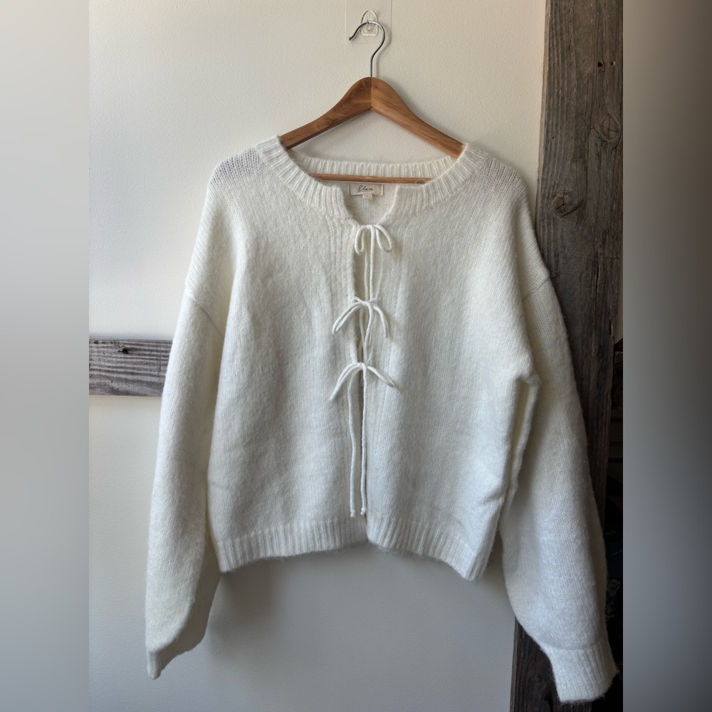 cream sweater with tie front closure